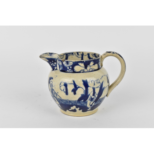 170 - A 19th century blue and white pearlware jug, in the Chinese taste, the rim with floral frieze above ... 