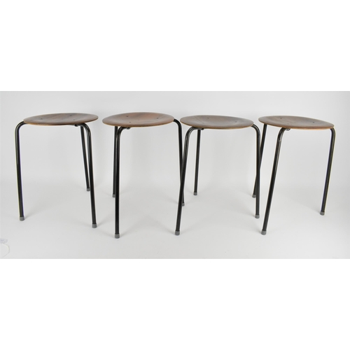 78 - A set of four Arne Jacobsen for Fritz Hansen style 'Dot' stools, with circular seat rests on tripod ... 