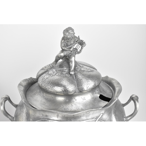 79 - An Art Nouveau Kayserzinn (1862-1925) pewter lidded punch bowl, the lobbed body with heart shaped ca... 