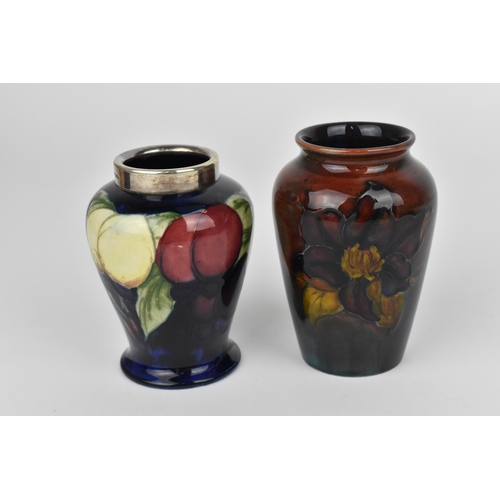 81 - A Walter Moorcroft 'Clematis' pattern flambe vase, of tapered form with everted rim, the body with t... 