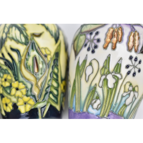 83 - A cased set of Moorcroft pottery small posy vases, in various floral patterns, dated 2000, possibly ... 