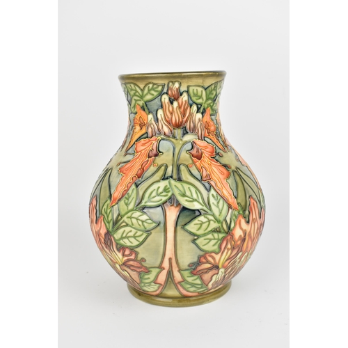 85 - A Moorcroft pottery 'Flame of the Forest' vase designed by Philip Gibson, 1997, shape 869/9, of balu... 