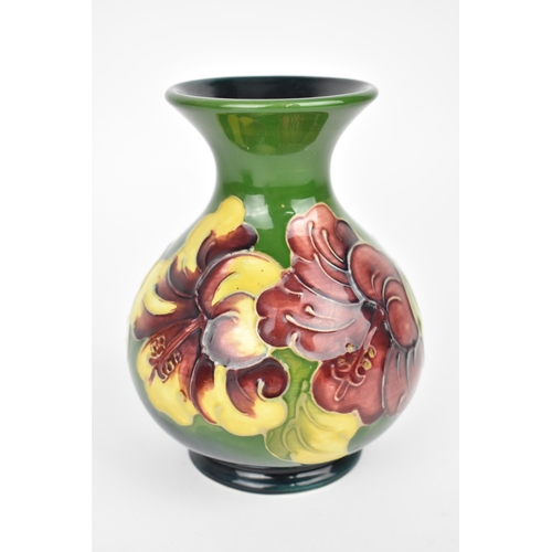 88 - A Moorcroft pottery 'Hibiscus' pattern vase, designed with globular body and everted rim decorated w... 