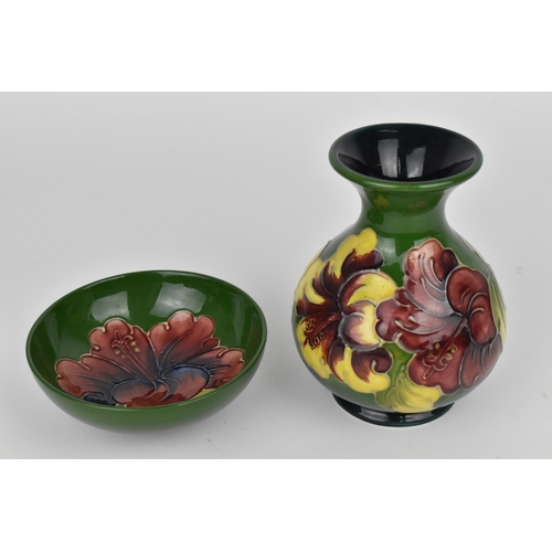 88 - A Moorcroft pottery 'Hibiscus' pattern vase, designed with globular body and everted rim decorated w... 