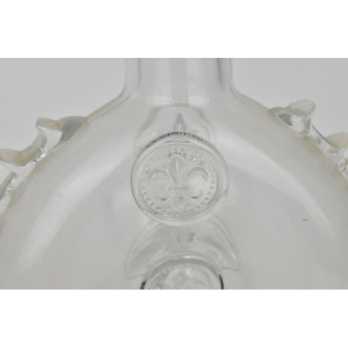 177 - A Baccarat for Remy Martin cognac bottle, of flat circular form with pressed fleur de lys motifs in ... 