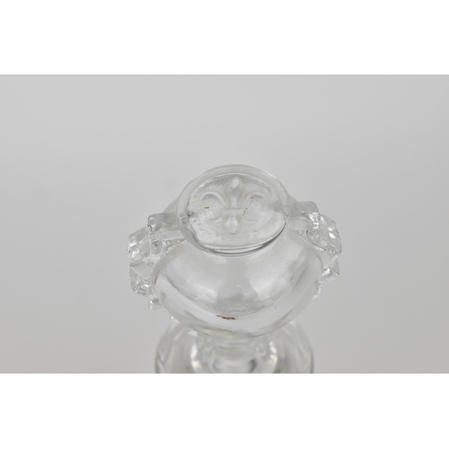 177 - A Baccarat for Remy Martin cognac bottle, of flat circular form with pressed fleur de lys motifs in ... 