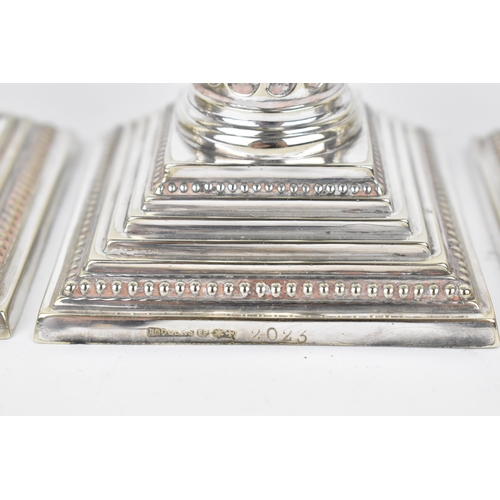 178 - A set of four George III style silver plated candlesticks by Joseph Rodgers & Sons, the twist fluted... 