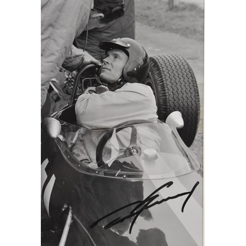 198 - A signed reprinted photograph of Dan Gurney - in a racing car at Goodwood 1964, printed with the ori... 