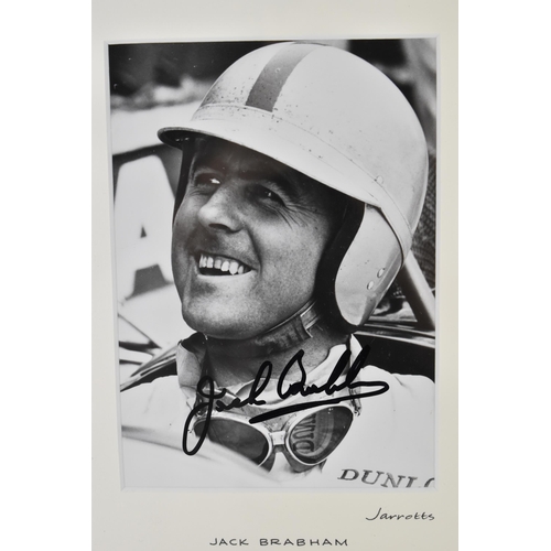 200 - A signed reprinted photograph of Jack Brabham in a racing car, printed with the original negative, J... 