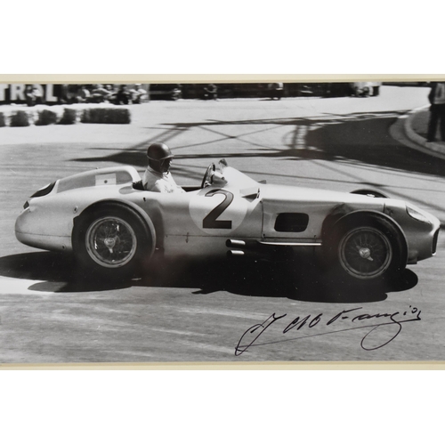 202 - A signed reprinted photograph of Juan Manuel Fangio, racing a Mercedes Benz, Grand Prix de Monaco 19... 