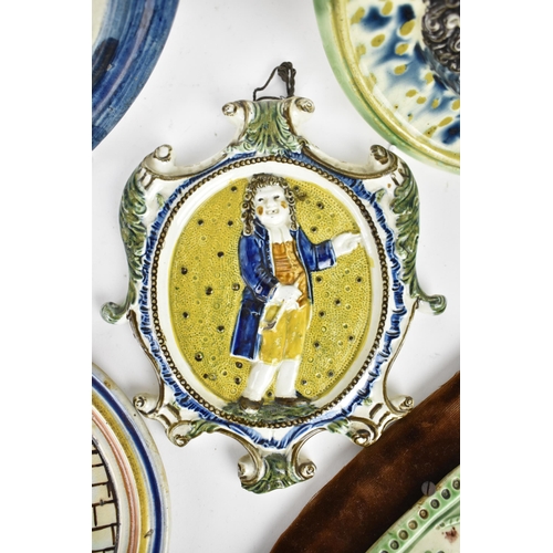 206 - A small group of early 19th century prattware relief plaques, to include a sailor saying goodbye to ... 