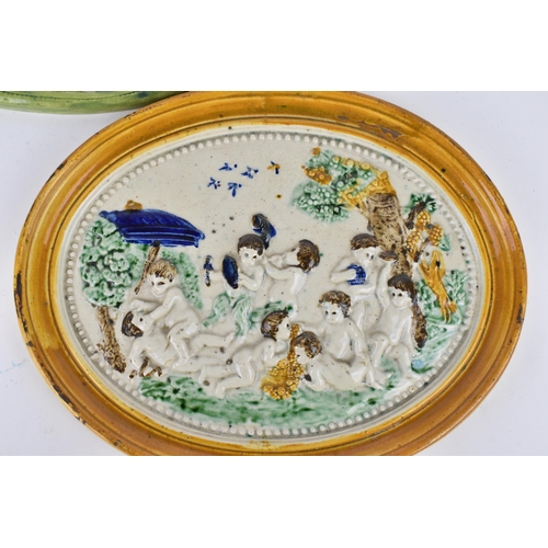 207 - A small group of early 19th century prattware plaques, to include a bacchanalian scene with a satyr ... 