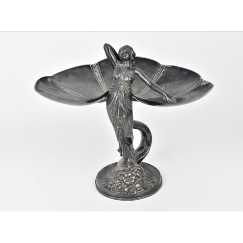 72 - An Art Nouveau WMF silver plated card tray modelled as a maiden in draped clothing with standing on ... 