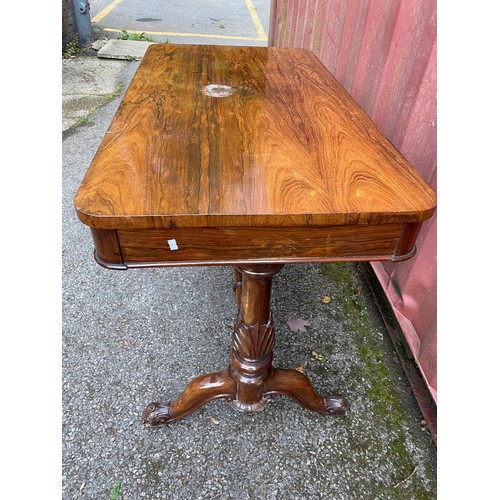 210 - A William IV rosewood centre table with a long frieze drawer, over twin turned carved columns with c... 