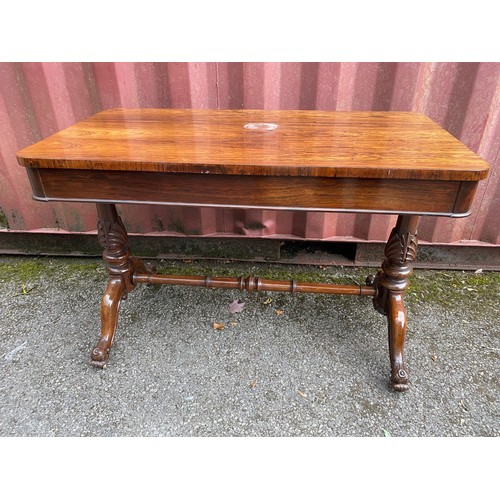 210 - A William IV rosewood centre table with a long frieze drawer, over twin turned carved columns with c... 