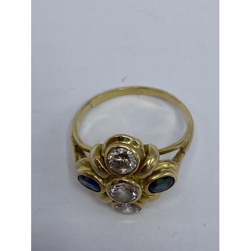 238 - A yellow metal diamond and sapphire ring having three round brilliant cut diamonds approx 4.8mm dia ... 