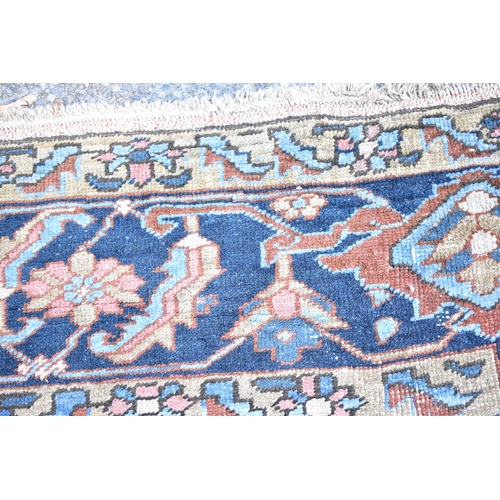 153 - A Tabriz carpet with a central medallion, geometric palmets, flowers, vines and spandrels in pastel ... 