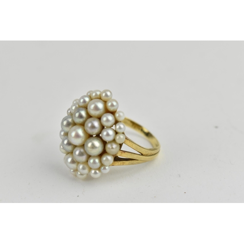 235 - An 18ct yellow gold ring set with numerous graduating pearls, (one deficient), stamped PG LD, size Q... 