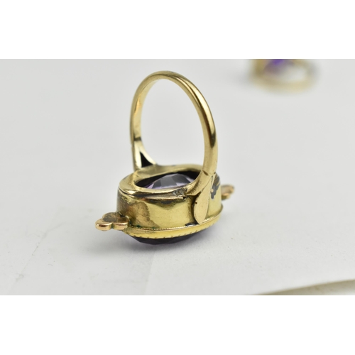 236 - A gold coloured ring and a gold plated ring set with seed pearls, each set with a purple stone