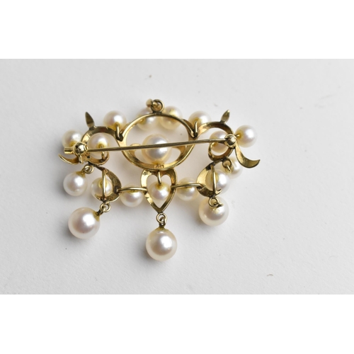 241 - A gold coloured metal brooch set with three rows of pearls and three pearl pendants, stamped 14k, 10... 