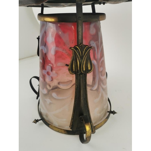 65 - An Arts and Crafts period lantern, in the style of  the hammered copper and brass fitting with funne... 