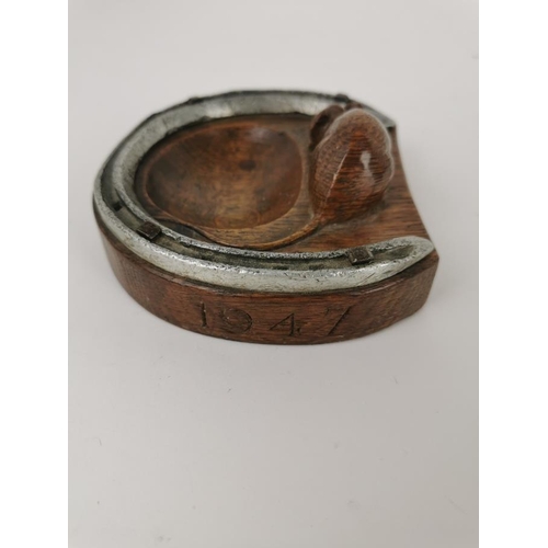 77 - Robert 'Mouseman' Thompson of Kilburn (1876-1955), a carved oak and steel horseshoe pin tray, with s... 