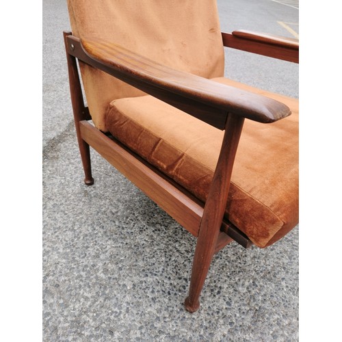 95 - A Guy Rogers Manhattan teak framed open reclining armchair with brown dralon upholstery, on rounded ... 