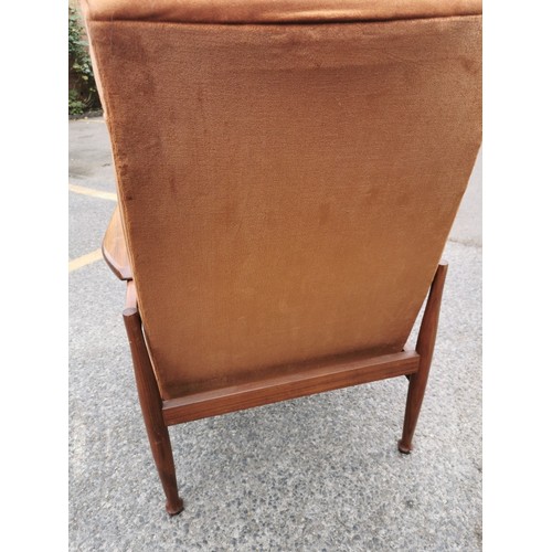 95 - A Guy Rogers Manhattan teak framed open reclining armchair with brown dralon upholstery, on rounded ... 