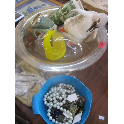 69 - A miscellaneous lot to include a Sarreguemines penguin, a Ronqvist glass egg shaped ornament, a fram... 