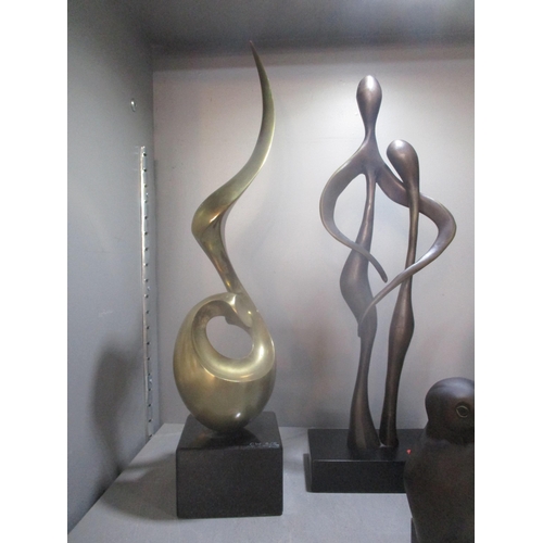 86 - A group of contemporary bronze, brass and resin sculptures to include a patinated brass sculpture of... 