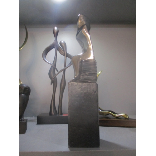 86 - A group of contemporary bronze, brass and resin sculptures to include a patinated brass sculpture of... 
