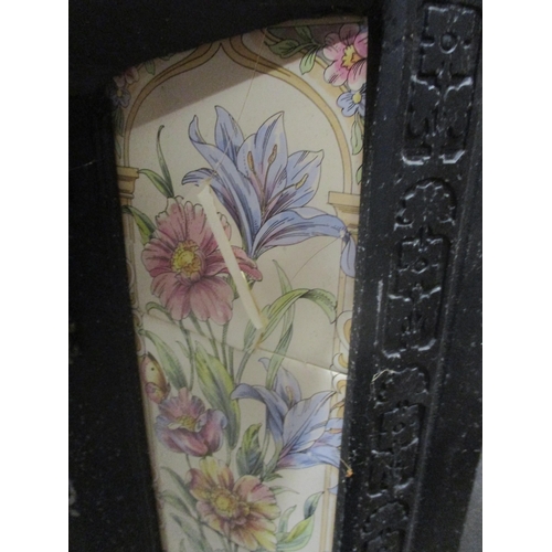 98 - A cast iron fireplace inset with later floral pattern tiles, two tiles damaged 96cm x 96cm
Location:... 