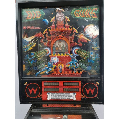 98A - A 1980s retro pinball arcade machine: 'Big Guns' by Williams, model 557, with tall illuminated backb... 