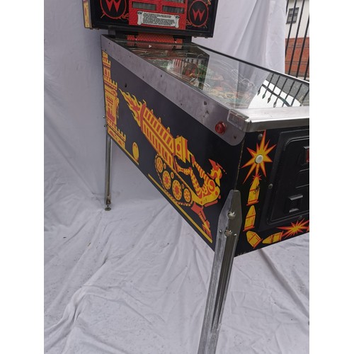 98A - A 1980s retro pinball arcade machine: 'Big Guns' by Williams, model 557, with tall illuminated backb... 