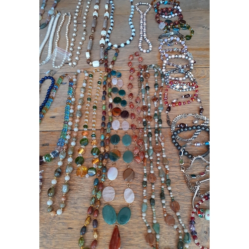 38 - A large quantity of late 20th Century to modern day bead necklaces to include a double strand of Aur... 