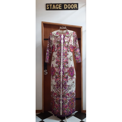 63 - Four 1970's ladies full length polyester dresses comprising an Elmor of London pink psychedelic dres... 