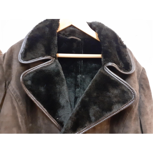 71 - Two vintage coats comprising a Scandinavian Fur Company brown beaver lamb coat with brown musquash f... 