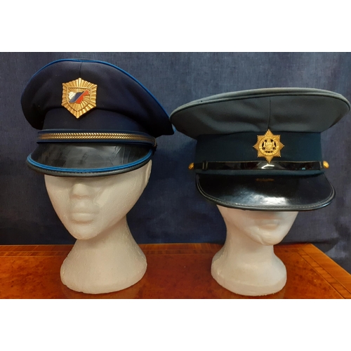 77 - Four Worldwide police hats comprising a Mexican Policia Fiscal Federal Agente cap, size 56, an Ameri... 