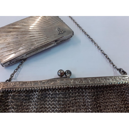 80 - An early 20th Century, white metal chain evening bag together with an Art Deco white metal compact. ... 