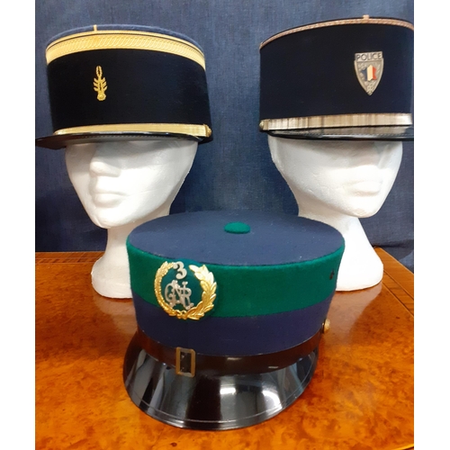 86 - Six Worldwide police caps comprising an RAF police cap made by A.Grantham, size 55, 2 French Gendarm... 