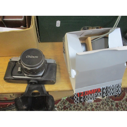 41 - A selection of film and digital cameras, lens, camera bags and accessories to include a Canon E05 30... 
