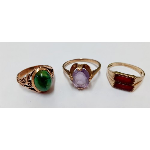 22 - A 14ct gold and green stone ring, 3.45g, UK ring size J and a 9ct gold and 2 rectangular red coloure... 