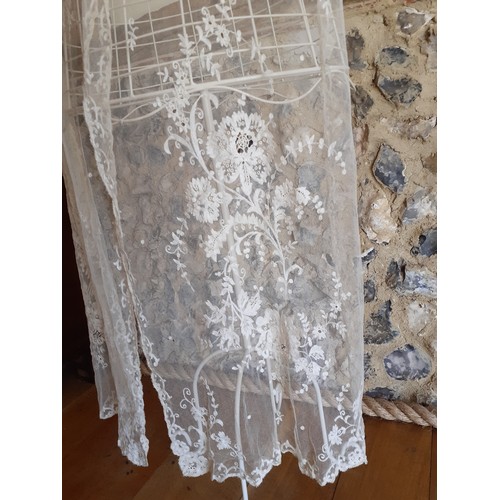 95 - An early 20th Century cream wedding veil and an early 20th Century cream lace item of clothing later... 