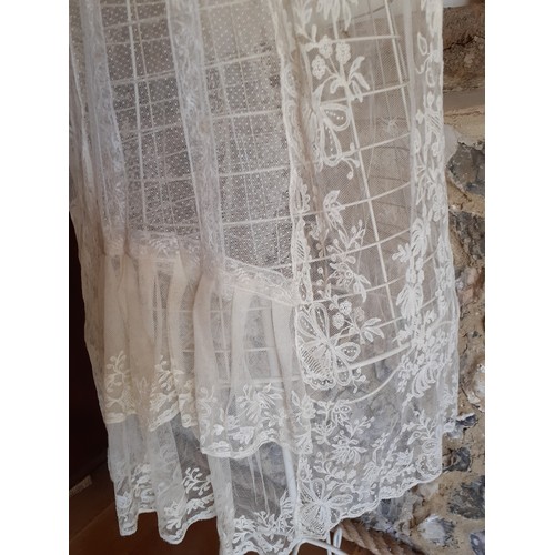 95 - An early 20th Century cream wedding veil and an early 20th Century cream lace item of clothing later... 