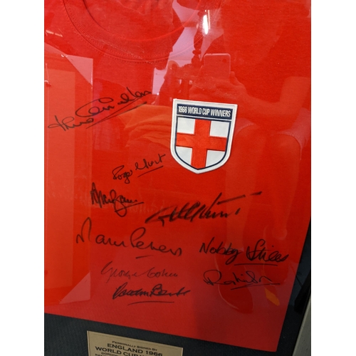 164 - A signed England football shirt signed by nine of the 1966 World Cup Winners
Location: RWF