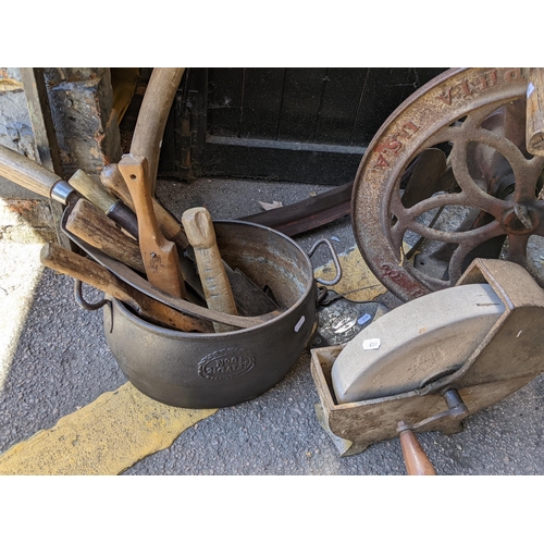 215 - A mixed lot to include a scythe, kibbling wheel, hand tools and other items Location:G