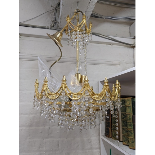 233 - A pair of gilt metal and crystal drop chandelier
Location: SR