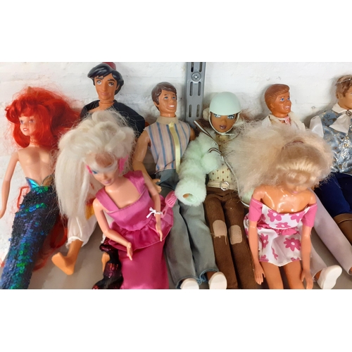 311 - A quantity of Mattel, Hasbro and other dolls, male and female, 1960's - 1990's to include Barbie, Ke... 