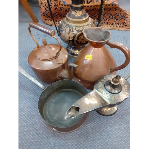 316 - Two large Middle Eastern metal ornaments comprising a coffee pot and an Aladin style pot together wi... 