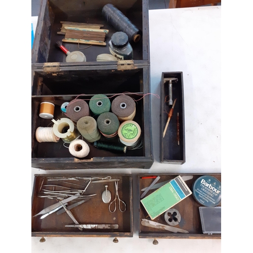 100 - An early 20th Century box containing thread, cotton reels, an ink bottle, tweezers and other items, ... 